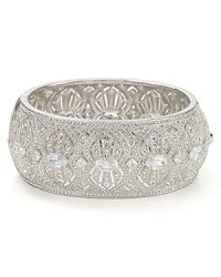 A chunky, crystal bedecked silhouette is a special solo-statement on this Lora Paolo bangle, styled to as an elegant add on for evening looks. A chunky, crystal bedecked silhouette is a special solo-statement on this Lora Paolo bangle, styled to as an elegant add on for evening looks.