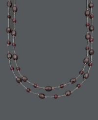 Add a subtle spark to your look with rich, red hues. This two-row necklace features 5 to 6 millimeter and 6 x 8 millimeter garnet beads (85 ct. t.w.) strung on delicate sterling silver chains. Approximate lengths: 16 and 17 inches. Add a subtle spark to your look with rich, red hues. This two-row necklace features 5 to 6 millimeter and 6 x 8 millimeter garnet beads (85 ct. t.w.) strung on delicate sterling silver chains. Approximate lengths: 16 and 17 inches.