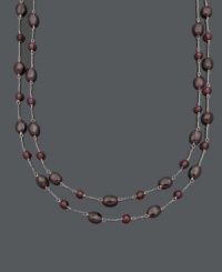 Add a subtle spark to your look with rich, red hues. This two-row necklace features 5 to 6 millimeter and 6 x 8 millimeter garnet beads (85 ct. t.w.) strung on delicate sterling silver chains. Approximate lengths: 16 and 17 inches.