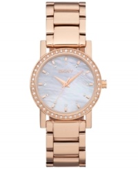 Ready to dazzle? This radiant watch by DKNY is the ticket. Rose-gold ion-plated stainless steel bracelet and round case. Bezel embellished with crystal accents. Mother-of-peal dial features rose-gold tone stick indices, crystal markers, three hands and logo. Quartz movement. Water resistant to 50 meters. Two-year limited warranty. Ready to dazzle? This radiant watch by DKNY is the ticket. Rose-gold ion-plated stainless steel bracelet and round case. Bezel embellished with crystal accents. Mother-of-peal dial features rose-gold tone stick indices, crystal markers, three hands and logo. Quartz movement. Water resistant to 50 meters. Two-year limited warranty.