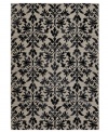 Reflections of Tibet. The Couristan Everest area rug features a beautiful floral pattern in shades of grey and black, crafted from thick-pile polypropylene that imparts a natural appearance and soft, luxurious finish.