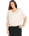 Elegant draping beautifully highlights Alfani's dolman sleeve plus size top, finished by a bubble hem. (Clearance)