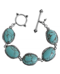 Breezy, bohemian style. Lucky Brand's chic toggle bracelet includes semi-precious turquoise stones set in antiqued silver tone mixed metal. Approximate length: 7-5/8 inches. Breezy, bohemian style. Lucky Brand's chic toggle bracelet includes semi-precious turquoise stones set in antiqued silver tone mixed metal. Approximate length: 7-5/8 inches.