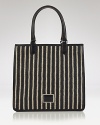 Take MARC BY MARC JACOBS' signature offbeat chic to the beach with this striped tote. In resort ready straw, this beachy bag lives to enliven a gauzy tunic and flat sandals.