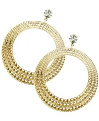 Set your inner-Gypsy free. The sweet cut-out shape and crystal design of GUESS's intricate hoops add a glam touch to any look. Set in gold tone mixed metal. Approximate drop: 3 inches. Set your inner-Gypsy free. The sweet cut-out shape and crystal design of GUESS's intricate hoops add a glam touch to any look. Set in gold tone mixed metal. Approximate drop: 3 inches.