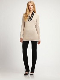 Far more than the traditional sweater, this wool design features an elongated silhouette and striking embellished neckline.Embellished necklineDropped shouldersLong sleevesPull-on styleAbout 26 from shoulder to hemWoolDry cleanImported Model shown is 5'10 (177cm) wearing US size Small.This style runs true to size. We recommend ordering your usual size for a standard fit. Far more than the traditional sweater, this wool design features an elongated silhouette and striking embellished neckline.Embellished necklineDropped shouldersLong sleevesPull-on styleAbout 26 from shoulder to hemWoolDry cleanImported Model shown is 5'10 (177cm) wearing US size Small.This style runs true to size. We recommend ordering your usual size for a standard fit.
