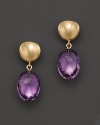 Faceted amethyst ovals, set in 14K yellow gold.