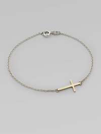 A simple, sleek cross of 14k gold sits sideways within a delicate sterling silver chain in this eloquent design.14k yellow gold and sterling silverLength, about 7Spring ring claspMade in USA A simple, sleek cross of 14k gold sits sideways within a delicate sterling silver chain in this eloquent design.14k yellow gold and sterling silverLength, about 7Spring ring claspMade in USA