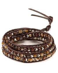 Simple yet eclectic. This Chan Luu leather wrap bracelet refines bohemian style with its mix of semi-precious gemstones and striking Swarovski crystals. Simple yet eclectic. This Chan Luu leather wrap bracelet refines bohemian style with its mix of semi-precious gemstones and striking Swarovski crystals.