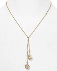 A simply styled link chain sets off a pair of crystal-bedecked tassels on this Lauren Ralph Lauren necklace, finished in plated metal. A simply styled link chain sets off a pair of crystal-bedecked tassels on this Lauren Ralph Lauren necklace, finished in plated metal.