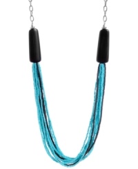 Time to fasten on some turquoise. Kenneth Cole New York's multi-strand necklace is made of mixed metal with imitation rhodium plating. Multiple strands of turquoise and brown beads are topped with brown and silver detailing. Approximate length: 36 inches + 3 inch extender.