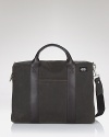 A modern take on the classic design, this Jack Spade briefcase style bag in rugged waxed cotton exudes workday cool.