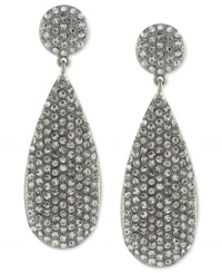 Vince Camuto's teardrop earrings light up the night. Crafted from silver-tone mixed metal, the pair features glistening pave crystal accents for a radiant touch. With a circular post closure. Approximate drop: 1-3/4 inches. Vince Camuto's teardrop earrings light up the night. Crafted from silver-tone mixed metal, the pair features glistening pave crystal accents for a radiant touch. With a circular post closure. Approximate drop: 1-3/4 inches.