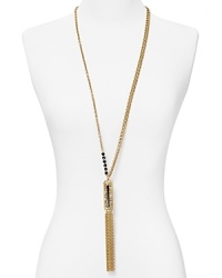 A Deco showpiece from T Tahari, this bold necklace brings instant glamor to your look, cast in plated metal with a tassel pendant. A Deco showpiece from T Tahari, this bold necklace brings instant glamor to your look, cast in plated metal with a tassel pendant.