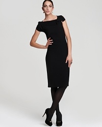 An asymmetrical neckline and draped shoulder shake up the classic T Tahari sheath dress for a strikingly modern silhouette. An asymmetrical neckline and draped shoulder shake up the classic T Tahari sheath dress for a strikingly modern silhouette.