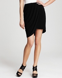 Delicately draped, T Tahari's tulip-front Martina skirt boats graceful pleating. A contrasting grosgrain tie at the waist adds a hint of subtle color. Delicately draped, T Tahari's tulip-front Martina skirt boats graceful pleating. A contrasting grosgrain tie at the waist adds a hint of subtle color.