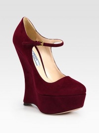 Iconic Mary Jane silhouette rendered in suede with a tall wedge and adjustable ankle strap. Self-covered wedge, 6 (150mm)Covered platform, 1¾ (45mm)Compares to a 4¼ heel (110mm)Suede upperAdjustable ankle strapLeather lining and solePadded insoleMade in Italy Iconic Mary Jane silhouette rendered in suede with a tall wedge and adjustable ankle strap. Self-covered wedge, 6 (150mm)Covered platform, 1¾ (45mm)Compares to a 4¼ heel (110mm)Suede upperAdjustable ankle strapLeather lining and solePadded insoleMade in Italy