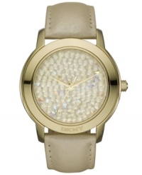 Raise a glass to this bubbly watch from DKNY. Crafted of champagne leather strap and oval light gunmetal ion-plated stainless steel case with logo at bezel. Dial features 106 gold tone crystal accents and three hands. Quartz movement. Water resistant to 50 meters. Two-year limited warranty. Raise a glass to this bubbly watch from DKNY. Crafted of champagne leather strap and oval light gunmetal ion-plated stainless steel case with logo at bezel. Dial features 106 gold tone crystal accents and three hands. Quartz movement. Water resistant to 50 meters. Two-year limited warranty.