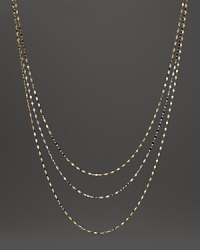 Delicate twisted chains of 14K white and yellow gold. Delicate twisted chains of 14K white and yellow gold.