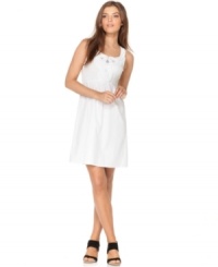 Smocking and swirling appliques create a captivating dress, from Calvin Klein Jeans. Mesh insets add edgy appeal. Smocking and swirling appliques create a captivating dress, from Calvin Klein Jeans. Mesh insets add edgy appeal.