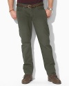 Casual pants tailored from sun-faded mid-weight chino, designed for authentic five-pocket styling and a straight leg. Standard-rise belted waist with Ralph Lauren's signature shank closure. Five-pocket jean styling with signature metal rivets. Flat-front with a timeworn, vintage feel.