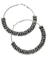 GUESS proves to be well-rounded with this pair of clutchless hoop earrings. Crafted from hematite-tone mixed metal, the earrings feature hematite-tone and glass crystal discs for a stunning effect. Approximate diameter: 2-1/2 inches. GUESS proves to be well-rounded with this pair of clutchless hoop earrings. Crafted from hematite-tone mixed metal, the earrings feature hematite-tone and glass crystal discs for a stunning effect. Approximate diameter: 2-1/2 inches.