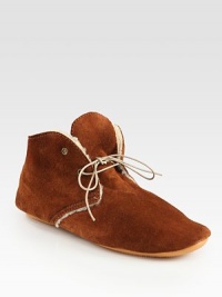 Cozy shearling lines this ultra-comfortable suede design with a rubber sole for added traction. Suede upperShearling liningRubber solePadded insoleMade in Italy Cozy shearling lines this ultra-comfortable suede design with a rubber sole for added traction. Suede upperShearling liningRubber solePadded insoleMade in Italy