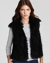 Add some edge to the everyday with a T Tahari faux-fur vest, slimly tailored and cinched with a ribbon at the waist for a refined walk on the wild side. Add some edge to the everyday with a T Tahari faux-fur vest, slimly tailored and cinched with a ribbon at the waist for a refined walk on the wild side.
