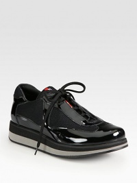 A multi-color micro-foam sole elevates this patent leather and mesh lace-up style. Rubber wedge with micro-foam insert, 1 (25mm)Rubber platform with micro-foam insert, ½ (15mm)Compares to a ½ heel (15mm)Patent leather and mesh upperLeather liningRubber solePadded insoleImported A multi-color micro-foam sole elevates this patent leather and mesh lace-up style. Rubber wedge with micro-foam insert, 1 (25mm)Rubber platform with micro-foam insert, ½ (15mm)Compares to a ½ heel (15mm)Patent leather and mesh upperLeather liningRubber solePadded insoleImported