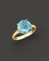 18K yellow gold is set with a faceted blue topaz.