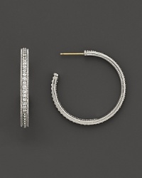 Pavé gems add glitter to classic sterling silver hoop earrings. Pavé gems add glitter to classic sterling silver hoop earrings.