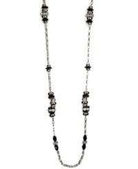 Define your style. This bold, beaded necklace by Nine West highlights plastic jet and clear bead stations strung from a silver tone mixed metal chain. Approximate length: 48 inches.