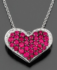 A full heart adorned with glittering, round-cut rubies (1-1/4 ct. t.w.) and diamonds (1/10 ct. t.w.) is sure to sweeten any outfit. This beautiful necklace is set in 14k white gold. Approximate length: 18 inches. Approximate drop: 1/2 inch. A full heart adorned with glittering, round-cut rubies (1-1/4 ct. t.w.) and diamonds (1/10 ct. t.w.) is sure to sweeten any outfit. This beautiful necklace is set in 14k white gold. Approximate length: 18 inches. Approximate drop: 1/2 inch.