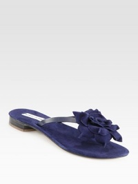 A flower tops this lush suede design with smooth leather straps. Suede and leather upperLeather solePadded insoleBlack has leather liningNavy has suede liningMade in Italy A flower tops this lush suede design with smooth leather straps. Suede and leather upperLeather solePadded insoleBlack has leather liningNavy has suede liningMade in Italy