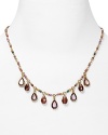 Strands of shimmering glass stones take on a new state of grace on this Lauren Ralph Lauren frontal drop necklace, set of by gleaming plated metal.