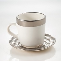Precious metals and porcelain capture the timeless shifting of ocean, wind and sand into lasting impressions inspired by the dunes of Truro, Cape Cod. Precious metals and porcelain capture the timeless shifting of ocean, wind and sand into lasting impressions inspired by the dunes of Truro, Cape Cod.