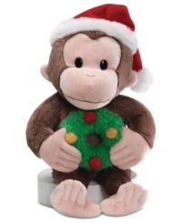Curious George is ready to monkey around the Christmas tree, clutching a wreath and capped with a red and white Santa hat in this crazy-cute Gund plush toy. Curious George is ready to monkey around the Christmas tree, clutching a wreath and capped with a red and white Santa hat in this crazy-cute Gund plush toy.
