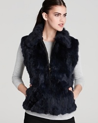 Layer on stunning style with Surell's zip-up fur vest-the perfect finishing touch over sweaters and blouses. Layer on stunning style with Surell's zip-up fur vest-the perfect finishing touch over sweaters and blouses.