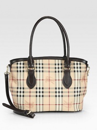 Iconic, check-print coated canvas accented with luxurious leather in a classic shape.Double top handles, 7 dropDetachable adjustable shoulder strap, 16-19¼ dropMagnetic snap closureProtective metal feetThree inner compartmentsOne inside zip pocketTwo inside open pocketsCanvas lining12½W X 10H X 4¾DImported Iconic, check-print coated canvas accented with luxurious leather in a classic shape.Double top handles, 7 dropDetachable adjustable shoulder strap, 16-19¼ dropMagnetic snap closureProtective metal feetThree inner compartmentsOne inside zip pocketTwo inside open pocketsCanvas lining12½W X 10H X 4¾DImported