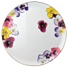 Pensees round tart platter by Bernardaud. This lively, luxurious collection is sure to transform your table into a celebration of spring. The floral watercolor pattern features delicate, multicolored pansies that appear to be strewn across the surface of each piece.