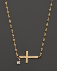 A delicate and modern necklace in yellow gold with diamond accent from Meira T. A delicate and modern necklace in yellow gold with diamond accent from Meira T.