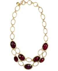 The double-row design of this Jones New York necklace flaunts oval links with red epoxy and abalone sheeting. Crafted in worn gold tone mixed metal. Approximate length: 15 inches + 2-1/2 inches. The double-row design of this Jones New York necklace flaunts oval links with red epoxy and abalone sheeting. Crafted in worn gold tone mixed metal. Approximate length: 15 inches + 2-1/2 inches.