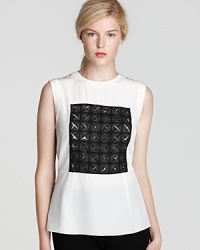 Make a statement with this graphically complex colorblock sleeveless top with a slight peplum waist for the perfect combination of edgy and feminine. Make a statement with this graphically complex colorblock sleeveless top with a slight peplum waist for the perfect combination of edgy and feminine.