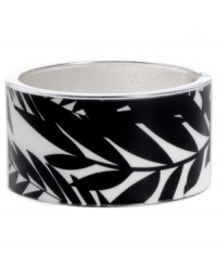 Infuse your look with the bold colors and exotic prints of Brasil. Crafted in silver tone mixed metal Haskell's Palm bangle features black and white palm leaf details and a hinge clasp. Approximate diameter: 2-1/2 inches. Approximate length: 8 inches. Item comes packaged in an orange gift box. Infuse your look with the bold colors and exotic prints of Brasil. Crafted in silver tone mixed metal Haskell's Palm bangle features black and white palm leaf details and a hinge clasp. Approximate diameter: 2-1/2 inches. Approximate length: 8 inches. Item comes packaged in an orange gift box.