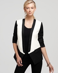 Give your look a sharp finish with Tibi's on-trend tuxedo jacket in chic monochrome color blocking. Give your look a sharp finish with Tibi's on-trend tuxedo jacket in chic monochrome color blocking.
