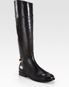 Beautiful equestrian-inspired silhouette of rich leather, backed by gleaming signature hardware. Stacked heel, 1 (25mm)Shaft, 17¼Leg circumference, 14Leather upperSide zipLeather lining and solePadded insoleImported