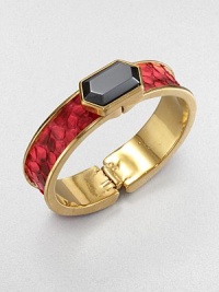 Vividly dyed python catches the eye in this striking bold bangle with a polished goldplated finish and a beveled hexagon of hematite as a centerpiece.HematitePythonGoldplated brassDiameter, about 2.5Width, about 1Hinged and claspedMade in USA