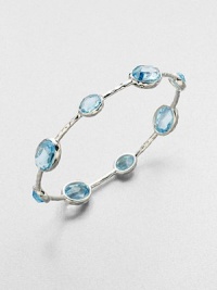 From the Rock Candy Collection. A graceful bangle of sculptural sterling silver is dotted with richly faceted ovals of dinsinctively hued blue topaz.Blue topazSterling silverDiameter, about 2.6Imported From the Rock Candy Collection. A graceful bangle of sculptural sterling silver is dotted with richly faceted ovals of dinsinctively hued blue topaz.Blue topazSterling silverDiameter, about 2.6Imported