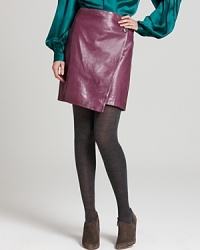 An ultra-luxe take on daytime chic, this Anne Klein Collection leather skirt fuses a figure-conscious silhouette with a flattering wrap detail. Style with a billowy blouse and statement heels to balance the look. An ultra-luxe take on daytime chic, this Anne Klein Collection leather skirt fuses a figure-conscious silhouette with a flattering wrap detail. Style with a billowy blouse and statement heels to balance the look.