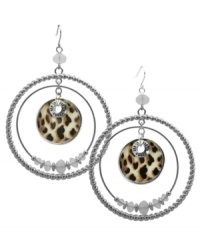 Double down on chic style. These double ring hoop earrings from GUESS go wild with a leopard print pendant at the center and white opal stones at the inner ring. Crafted in imitation rhodium-plated mixed metal. Approximate drop: 2-1/2 inches. Approximate diameter: 2 inches. Double down on chic style. These double ring hoop earrings from GUESS go wild with a leopard print pendant at the center and white opal stones at the inner ring. Crafted in imitation rhodium-plated mixed metal. Approximate drop: 2-1/2 inches. Approximate diameter: 2 inches.